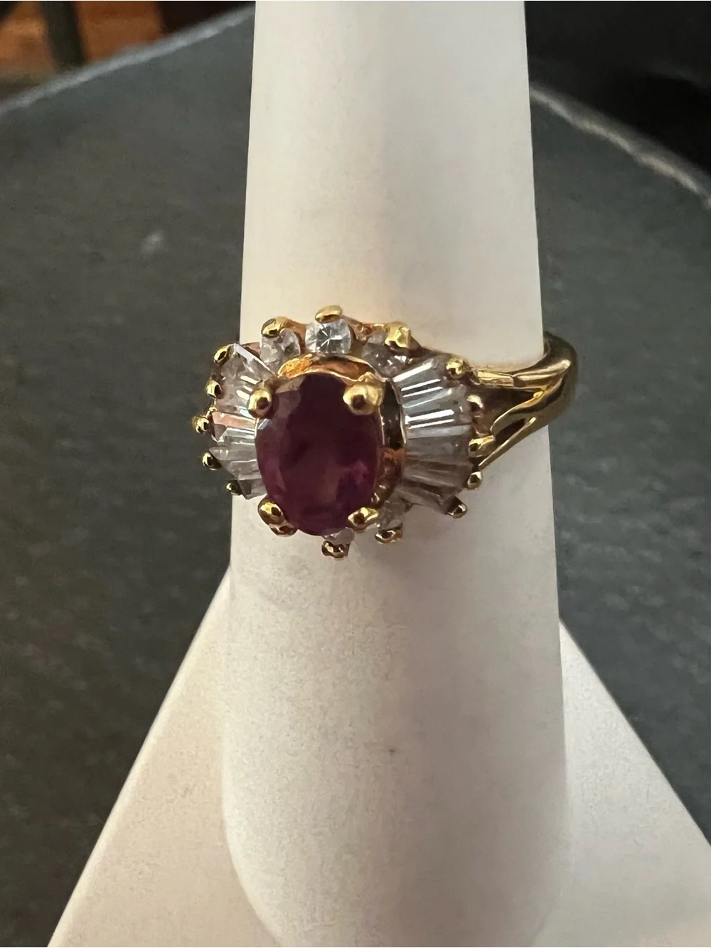 Gold Ring with Ruby-Red Center and Clear Accent Stones